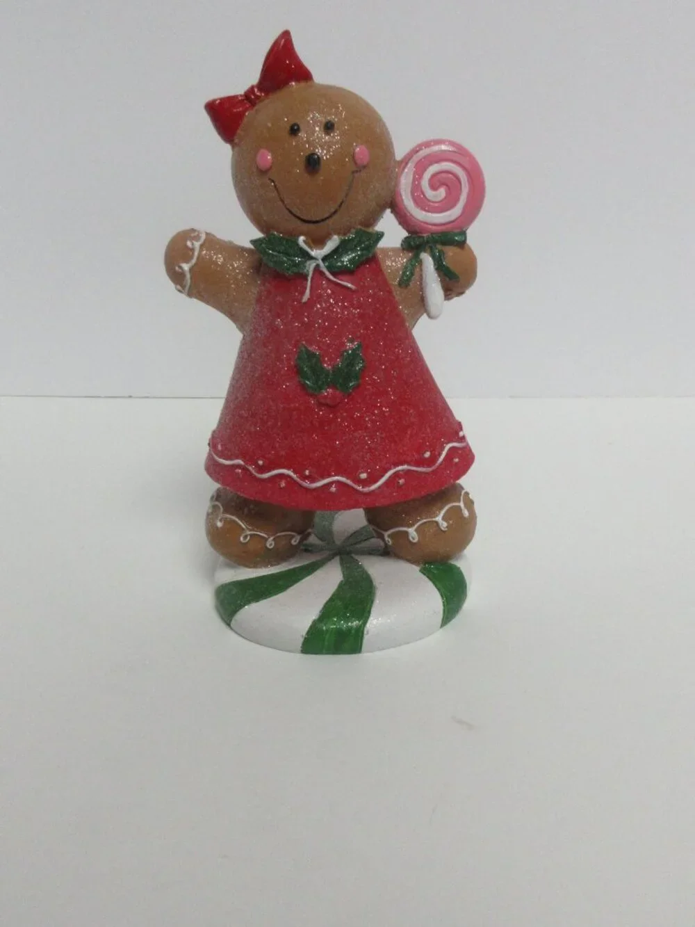 Festive Gingerbread Girl Figurine Holding Pink Lollipop